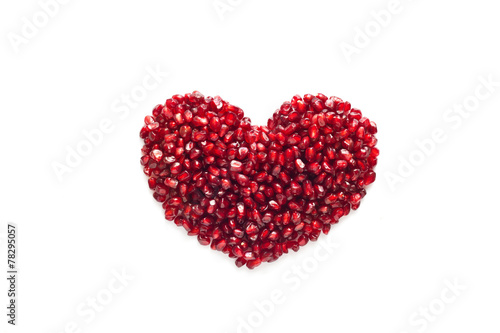heart shape from pomegranate seed on white background