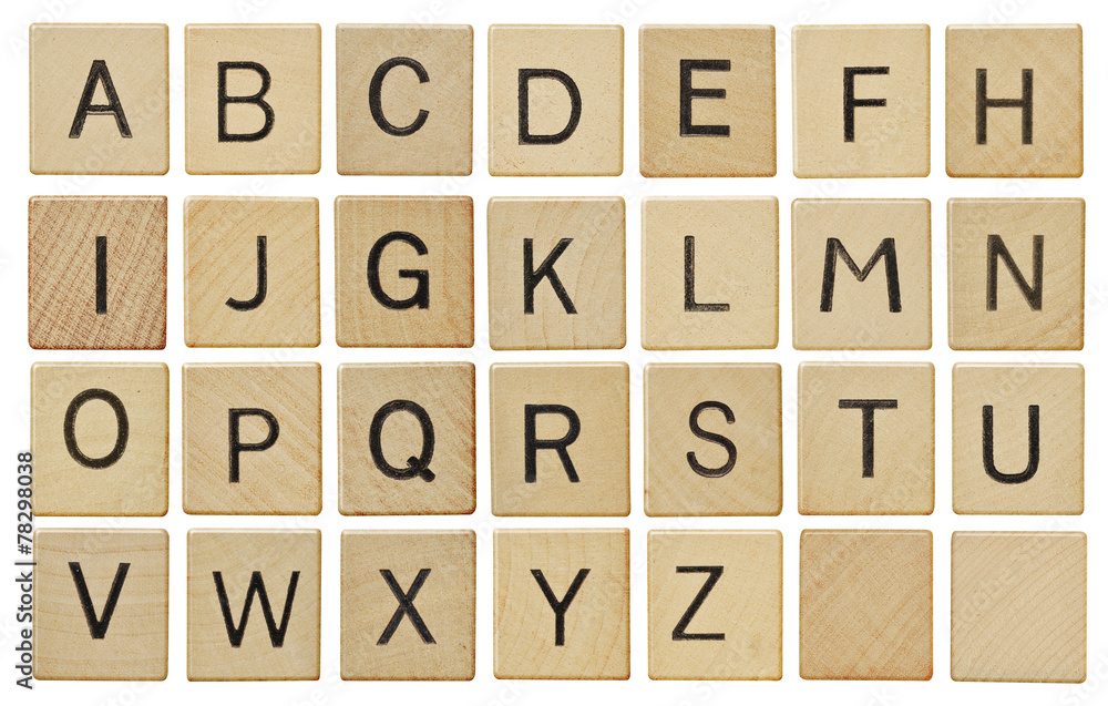 Alphabet letters on wooden scrabble pieces, isolated on white. - obrazy, fototapety, plakaty 