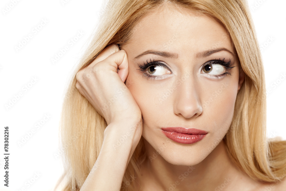 concerned young blonde on a white background concerned young blonde on a white background
