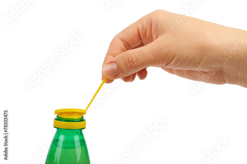 Hand opens a plastic bottle