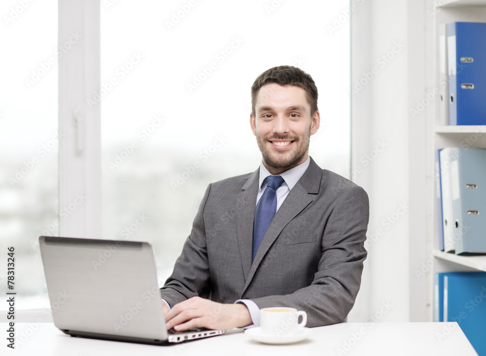 smiling businessman with laptop and coffee smiling businessman with laptop and coffee