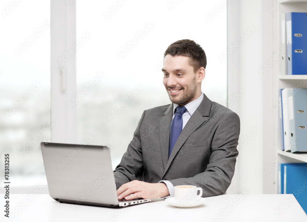 smiling businessman with laptop and coffee smiling businessman with laptop and coffee