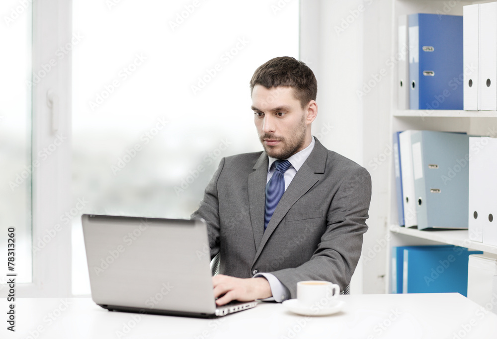 busy businessman with laptop and coffee busy businessman with laptop and coffee