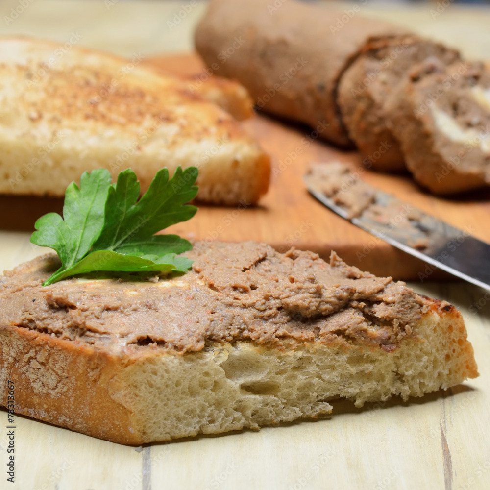 Roll pate, slices of toasted bread. Shallow depth of field. Roll pate, slices of toasted bread. Shallow depth of field.