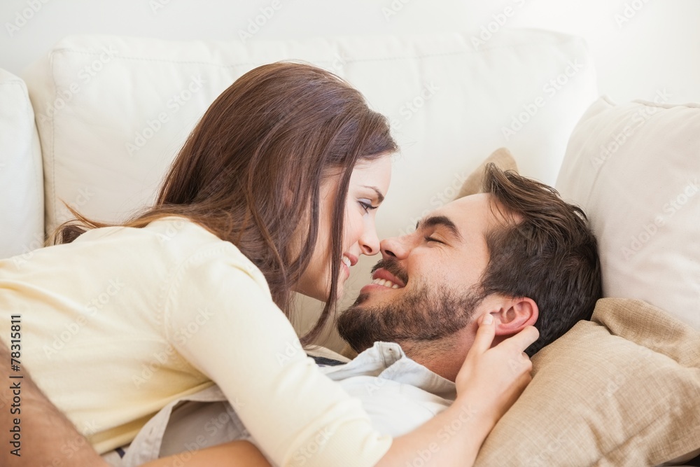 Cute couple relaxing on couch Cute couple relaxing on couch
