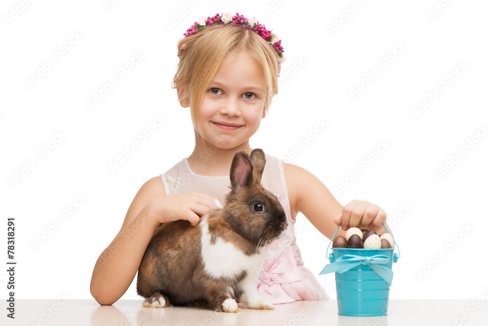Smiling girl with bunny and chocolate eggs Smiling girl with bunny and chocolate eggs