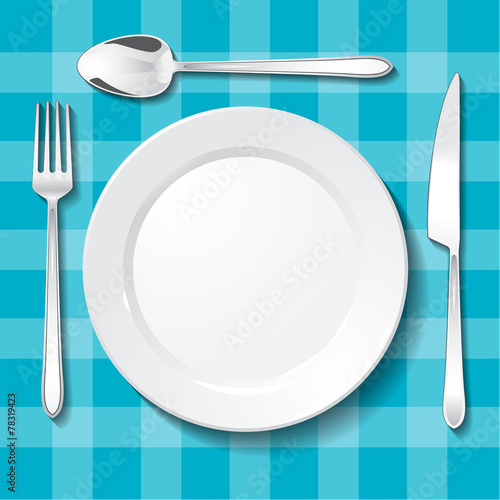 Table appointments. Empty plate on blue tablecloth