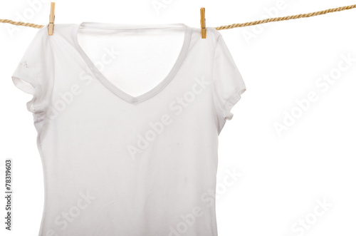 white tshirt hanging on a rope clothesline