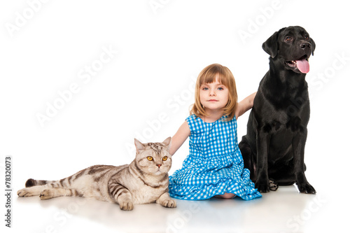 Little girl  with  dog and cat.