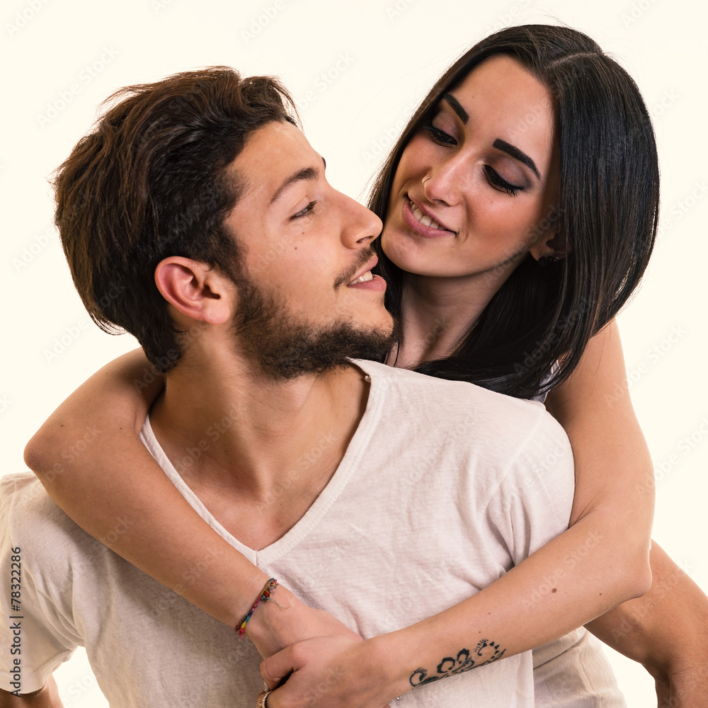 Obraz premium Young couple close up intimate studio portrait in a romantic moo