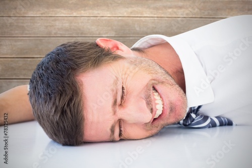 Billede på lærred Composite image of stressed businessman banging his head