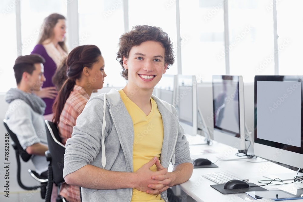 Student smiling at camera in computer class Student smiling at camera in computer class