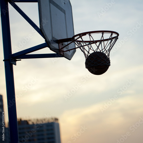 hoops basketball game on the streets ring with a net