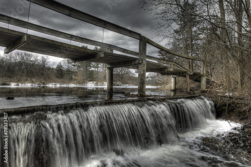 Wooden Walking Bridge Over Winter Waterfall