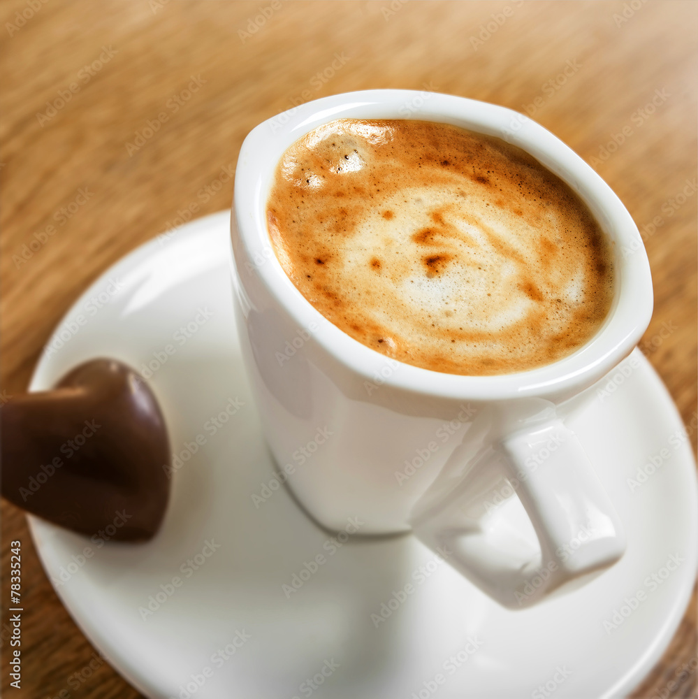 Cup of coffee with heart candy, love symbol Cup of coffee with heart candy, love symbol