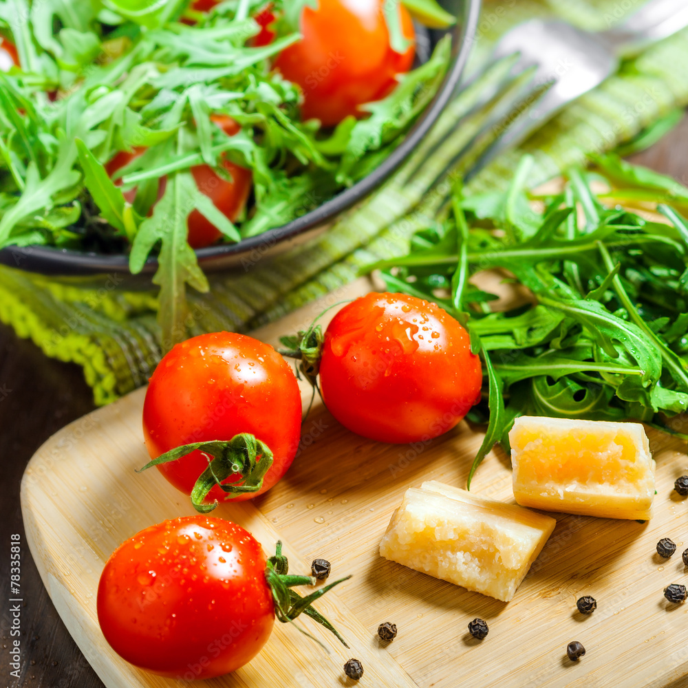 Vegetable salad with Parmesan on table Vegetable salad with Parmesan on table