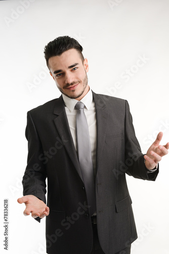 isolated young business man positive attitude with his hands