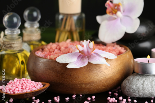 Beautiful spa composition with flowers on dark background
