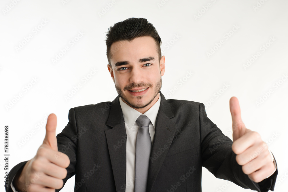 isolated business man in positive attitude with his thumbs up isolated business man in positive attitude with his thumbs up