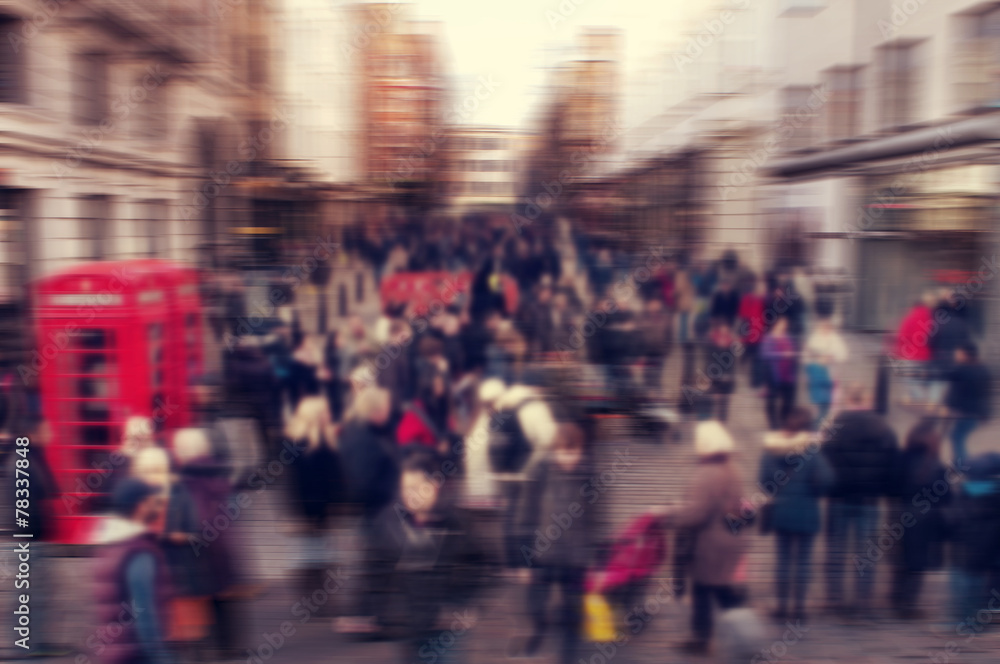 defocused blur background of people walking in a street in Londo