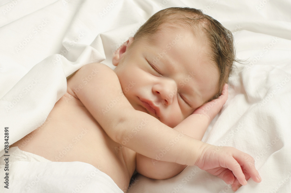 New born baby boy sleeping taking a nap in white sheets. New born baby boy sleeping taking a nap in white sheets.