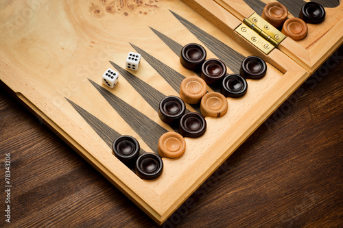 Photo Color detail of a Backgammon game with two dice