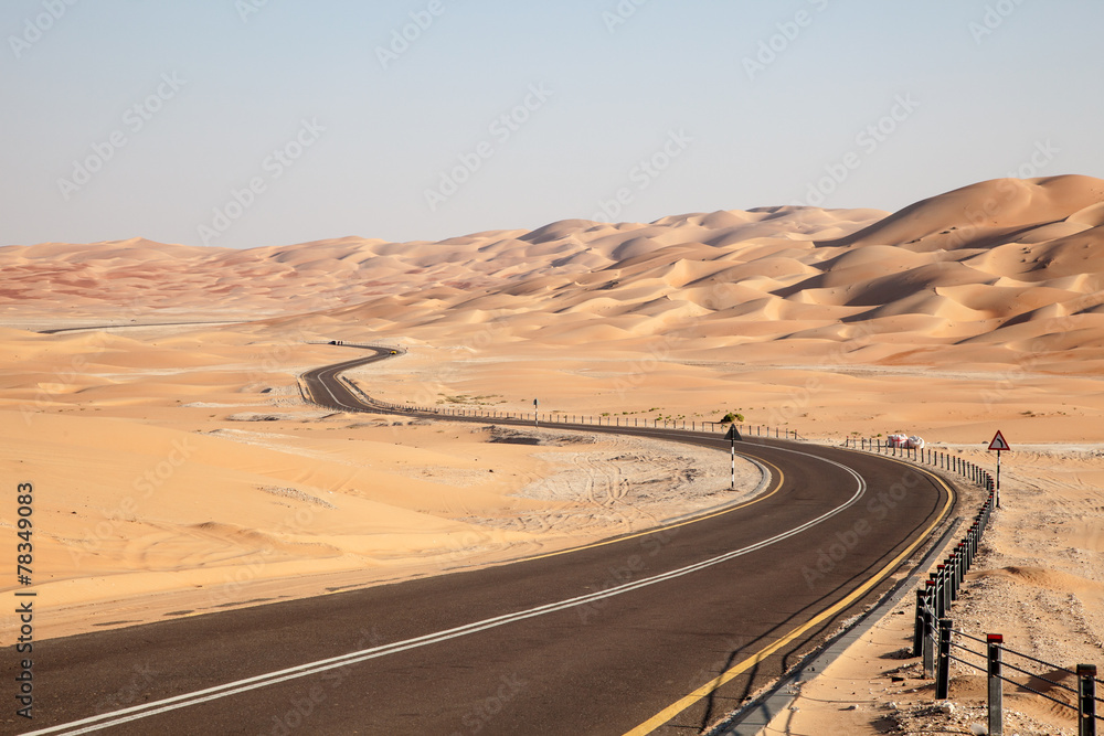Road through desert in Liwa Oasis, Abu Dhabi, UAE - obrazy, fototapety, plakaty 