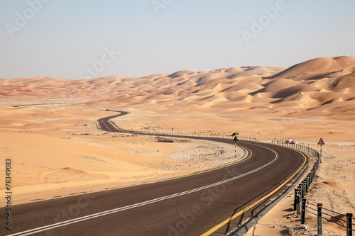 Road through desert in Liwa Oasis, Abu Dhabi, UAE photo