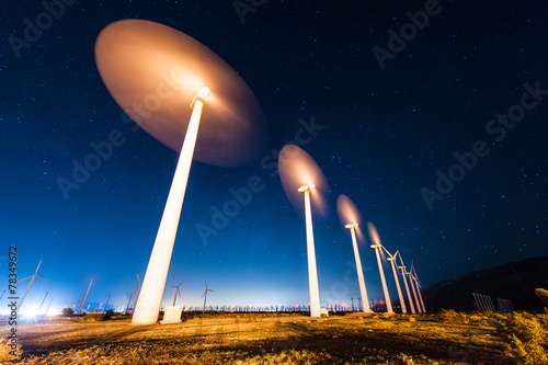 Wind Turbines in desert during sunrise time