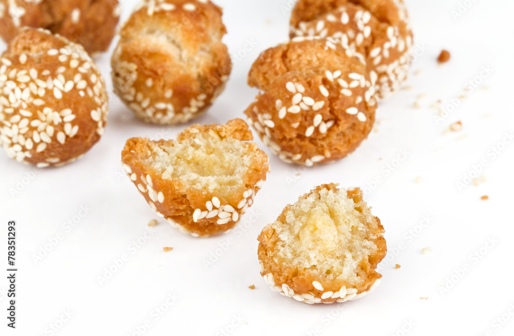 cracked donut ball with white sesame on white background cracked donut ball with white sesame on white background