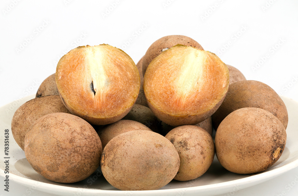 fresh Sapodilla - whole and half cut