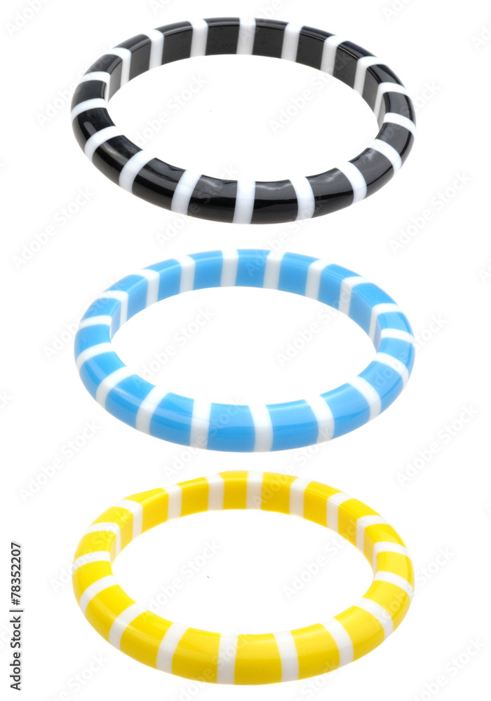 set of colourful plastic bracelets isolated on white set of colourful plastic bracelets isolated on white
