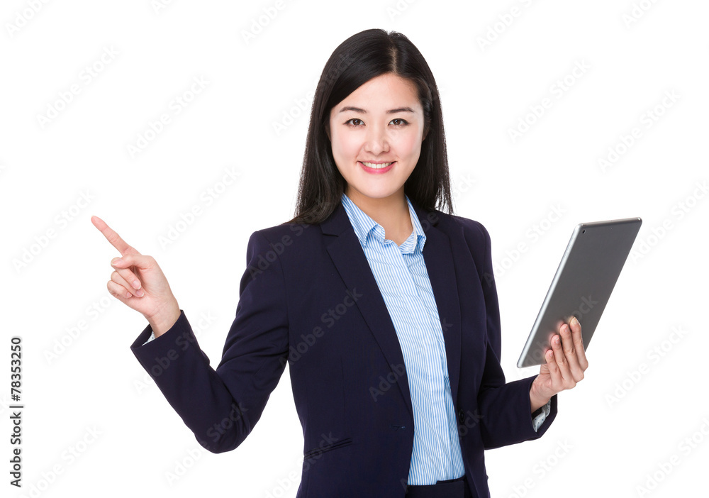 Businesswoman use of tablet and finger point up Businesswoman use of tablet and finger point up