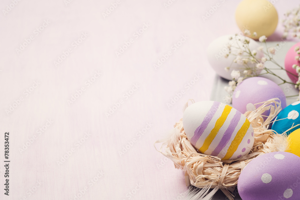 Colorful Easter eggs on a wooden table with space for text Colorful Easter eggs on a wooden table with space for text