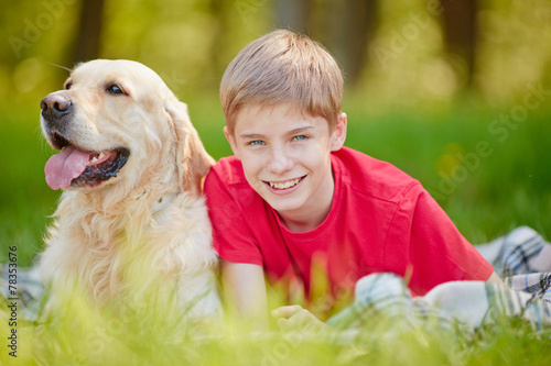 Boy and his dog © pressmaster