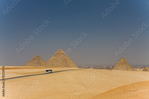 The road through the desert. Egyptian pyramids.