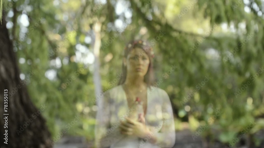 Woman ghost in the garden walking with sadness. Woman ghost in the garden walking with sadness.