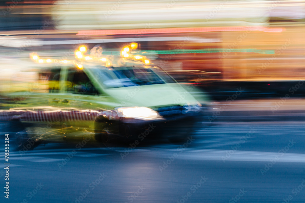 Ambulance Car in a Blurred City Scene Ambulance Car in a Blurred City Scene