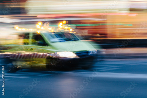 Ambulance Car in a Blurred City Scene