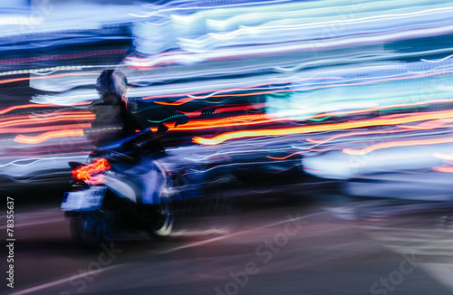 Scooter in a Blurred City Scene © SOMATUSCANI