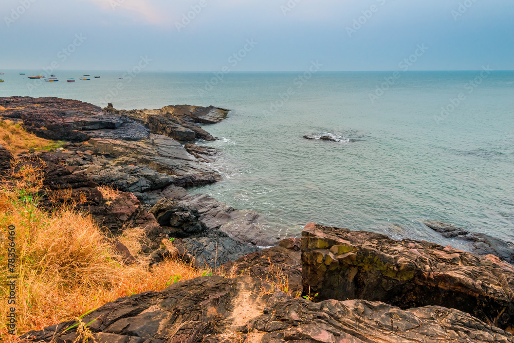 view of the sea horizon and the rocky shore