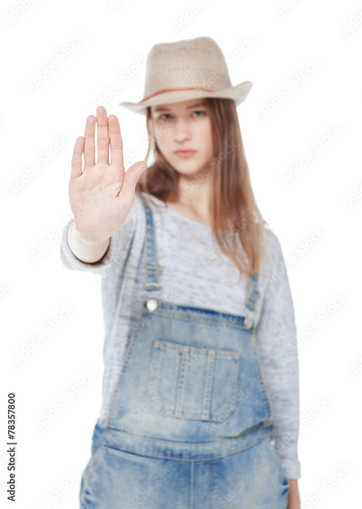 Young teenager girl making stop sign isolated. Focus on palm Young teenager girl making stop sign isolated. Focus on palm