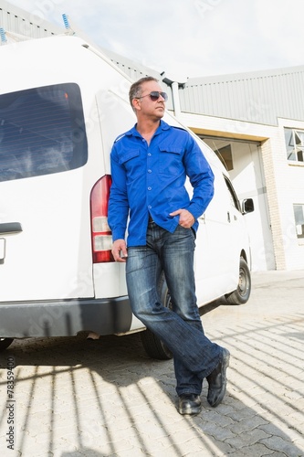 Handsome handyman posing with sunglasses