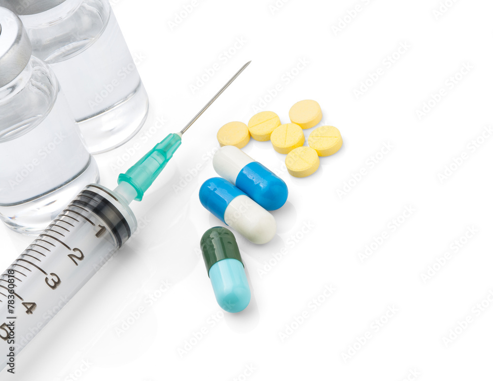 Syringe with medical ampoule and tablets on white background Syringe with medical ampoule and tablets on white background