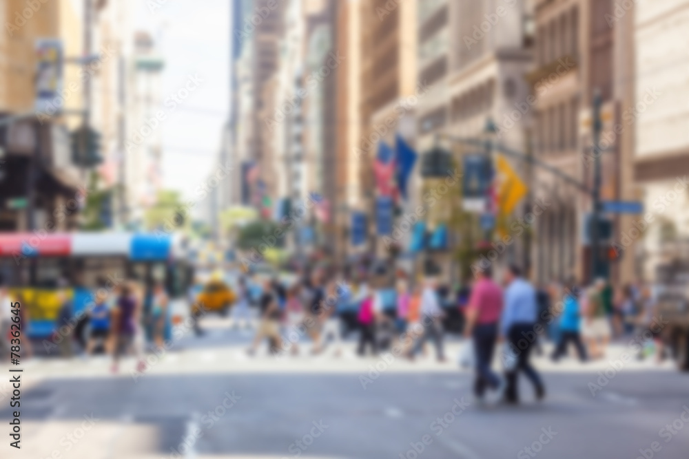 Crowded 5th Avenue with tourists crossing zebra. Blurred Backgro