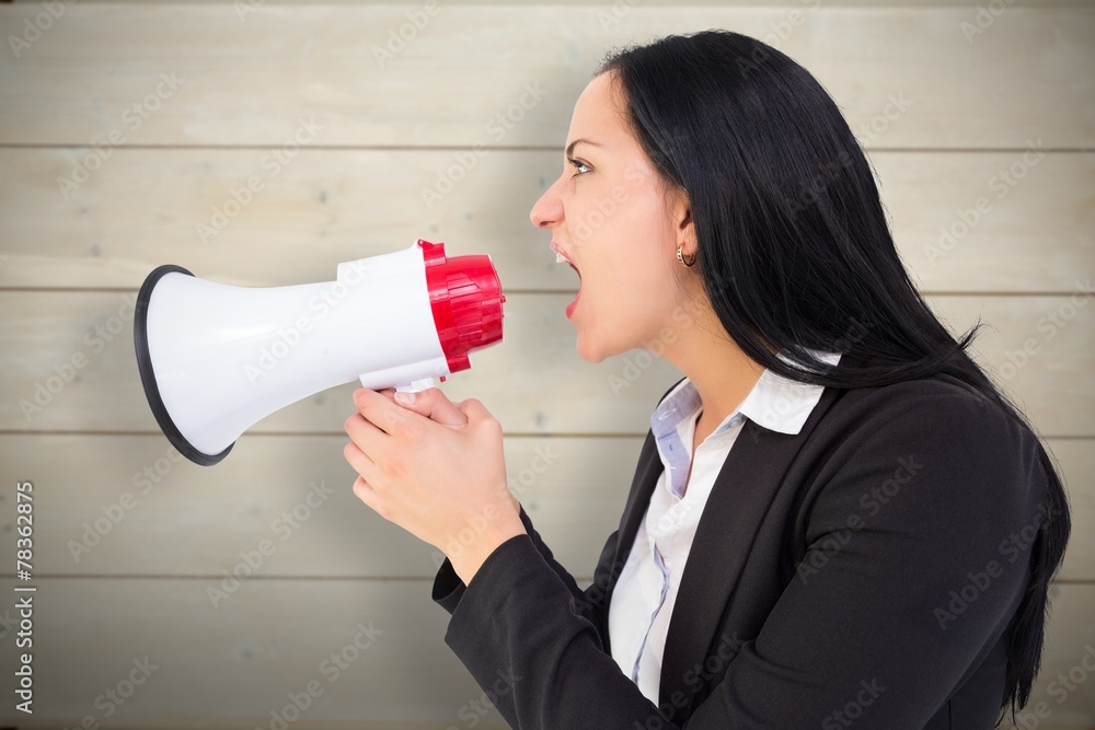 Composite image of pretty businesswoman shouting with megaphone Composite image of pretty businesswoman shouting with megaphone