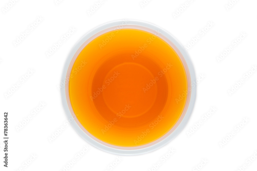 View from above of a plastic cup with yellow drink View from above of a plastic cup with yellow drink