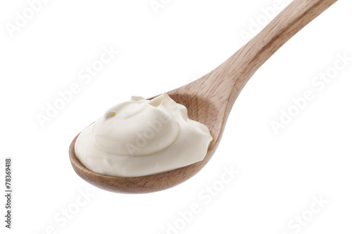 cream in spoon isolated