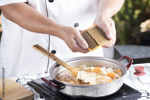Chef putting Japanese curry paste for cooking