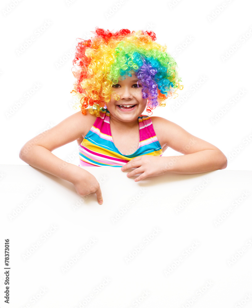 Girl in clown is holding blank banner Girl in clown is holding blank banner